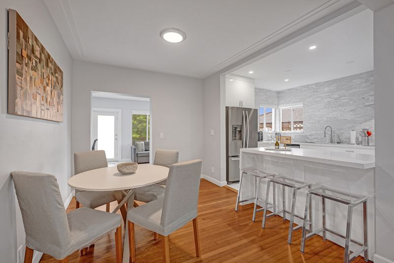 Dining area beside the renovated kitchen and breakfast bar