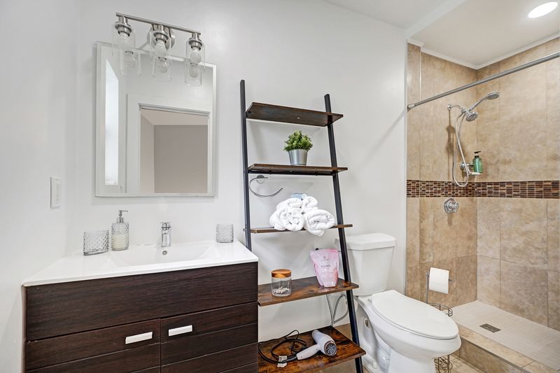 Renovated bathroom with a tiled walk-in shower