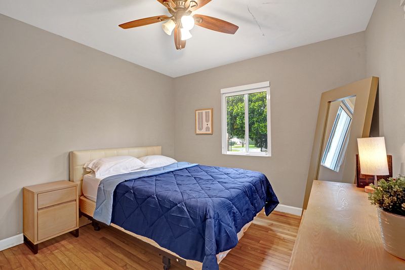 Second bedroom with a ceiling fan