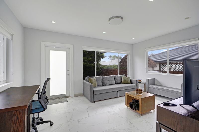 Florida room with a glass door and windows