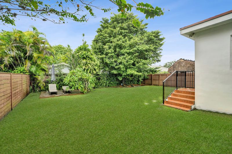 Backyard with lawn, rear steps and a deck
