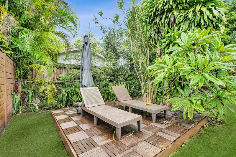Wood deck with lounge chairs in the backyard