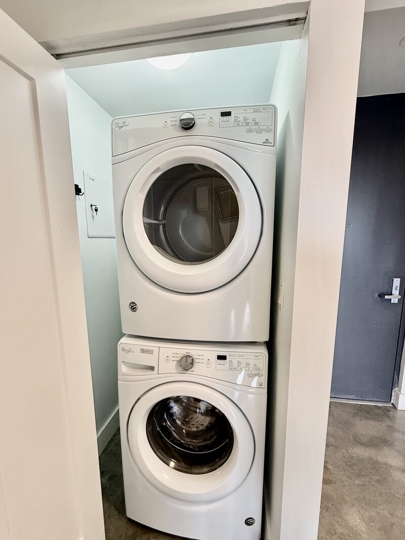Full-size stacked washer and dryer inside a unit at 4332 W Flagler Street