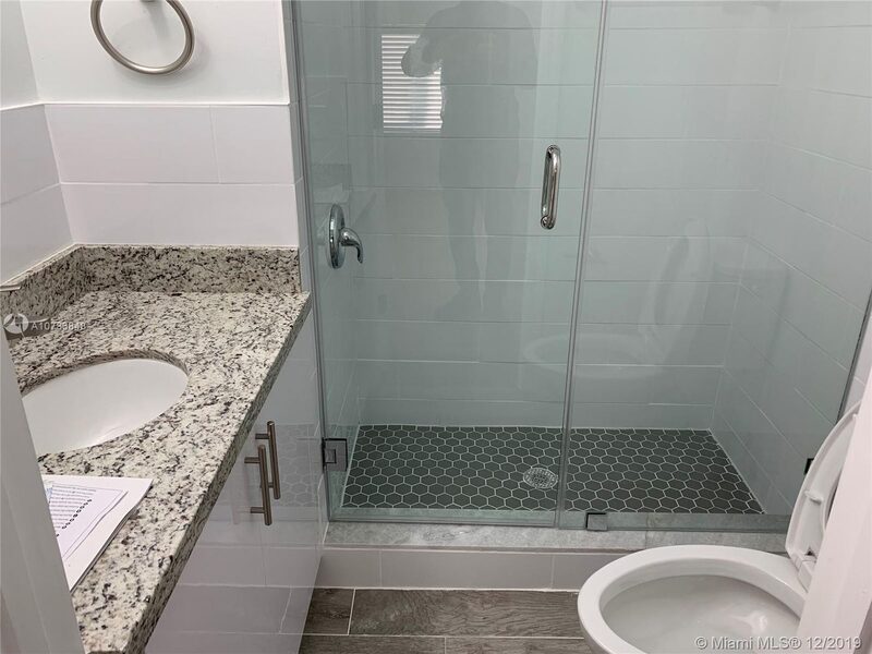 Renovated bathroom with a glass shower at 4331 SW 1st Street
