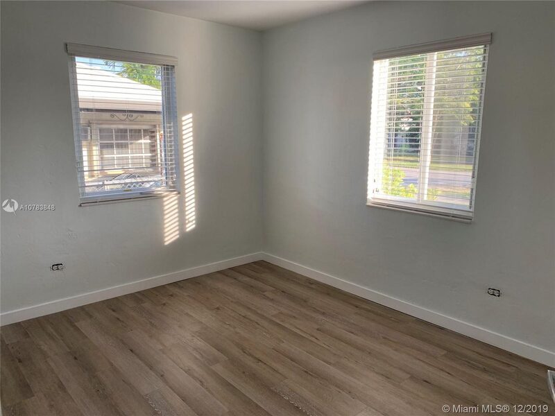 Bedroom with wood-look floors at 4331 SW 1st Street