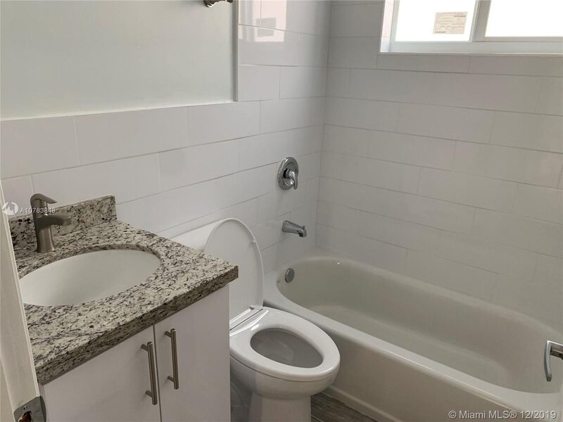 Renovated bathroom with a tub at 4331 SW 1st Street