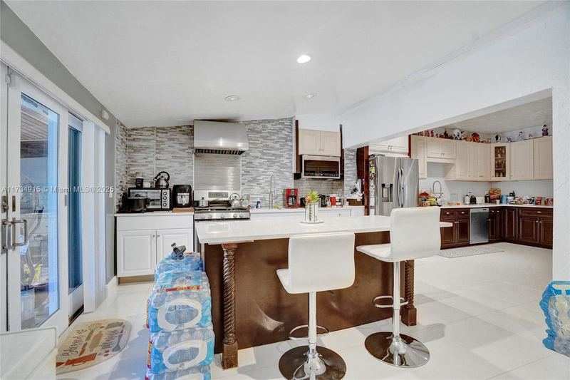 Kitchen with an island and breakfast bar