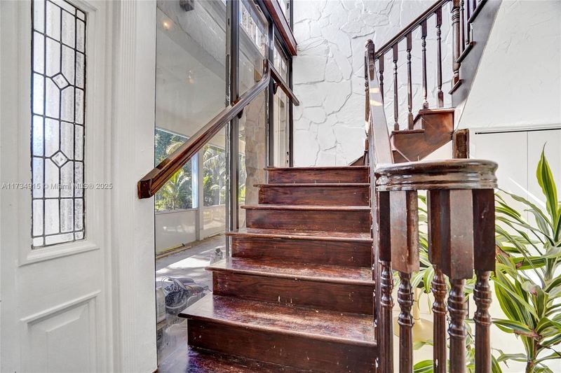 Wood staircase beside a window wall