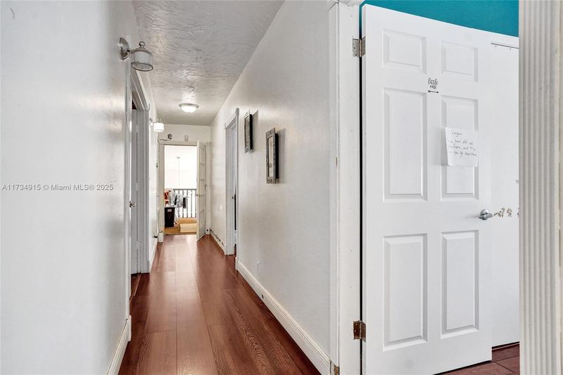 Upstairs hallway with wood floors