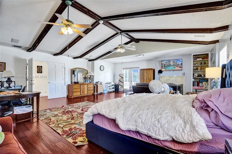 Primary suite with a beamed ceiling
