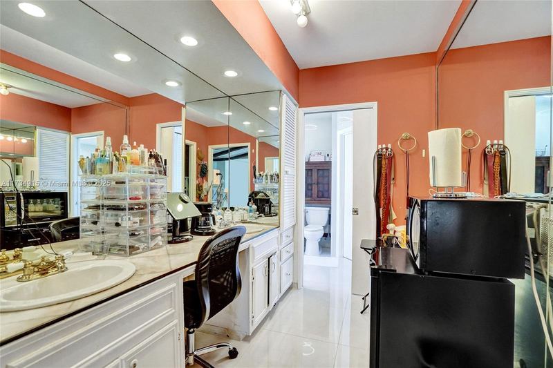Primary bath dressing area with a long vanity