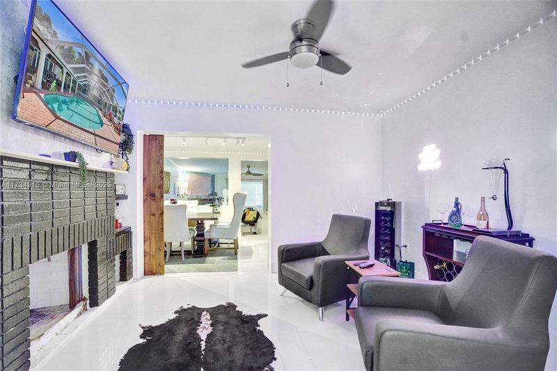 Living area with a black brick fireplace