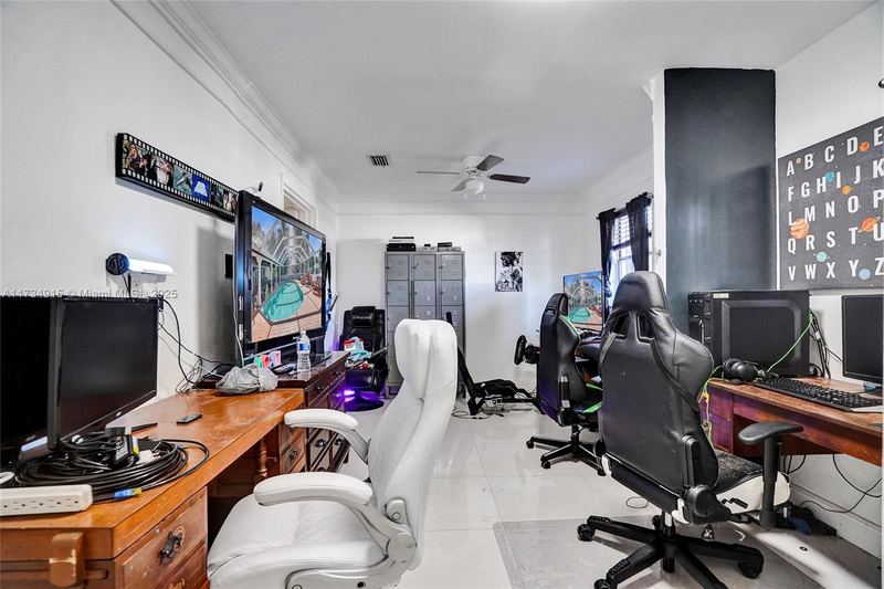 Room set up as a game room and office