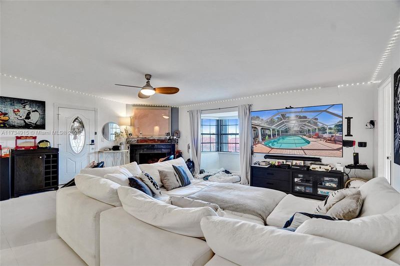 Family room with a fireplace and sectional