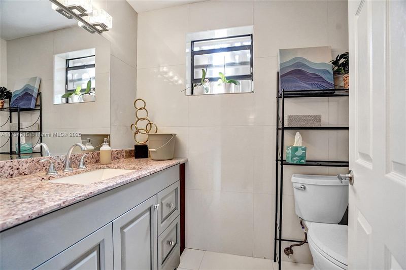 Bathroom with a granite vanity