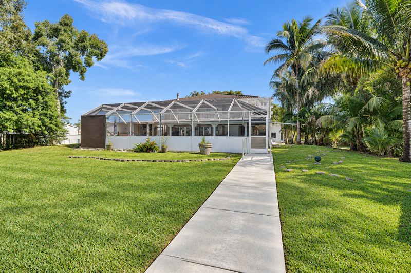 Screened pool enclosure seen from the lawn