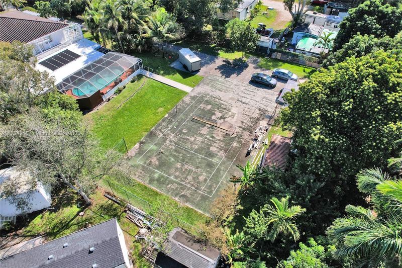 Aerial view of the house, pool and tennis court