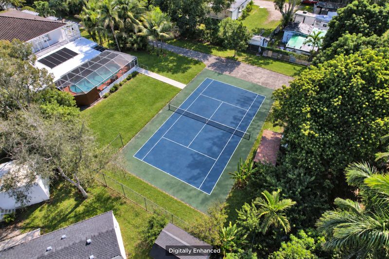 Aerial view with the tennis court shown refurbished, digitally enhanced