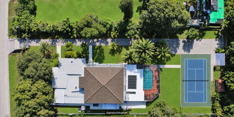Overhead aerial view with the tennis court shown refurbished, digitally enhanced