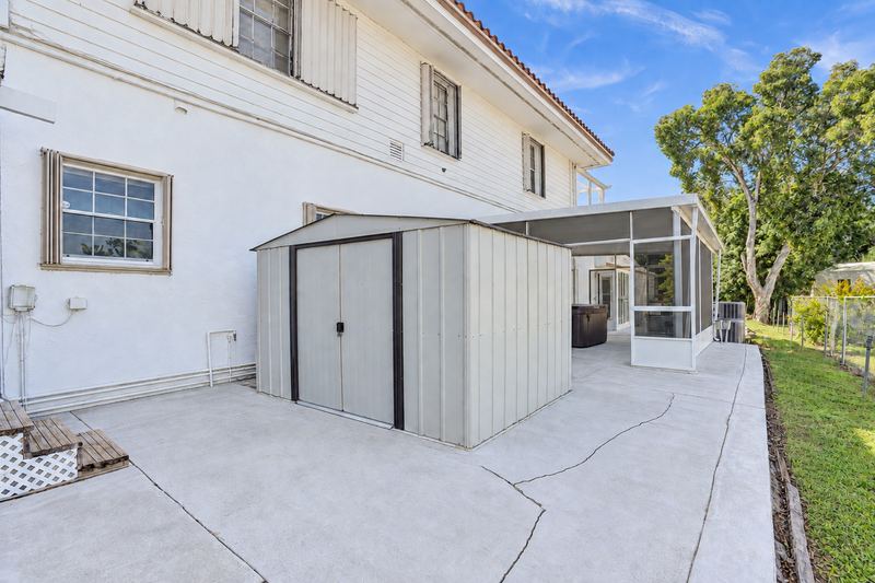 Side yard with a storage shed