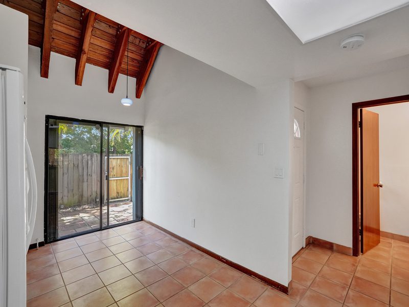Kitchen with a wood-beam ceiling at 4863 SW 71st Place, Miami