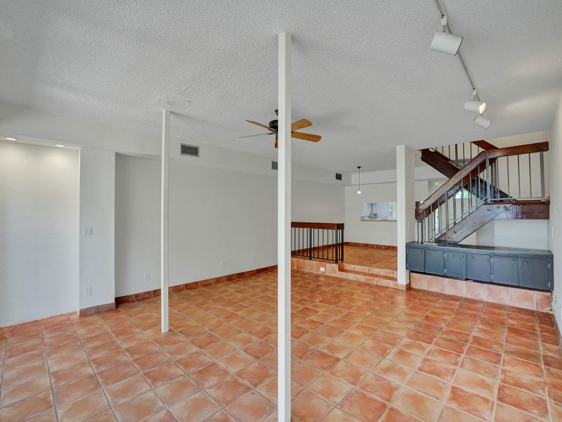 Living room with sliders to the deck at 4863 SW 71st Place, Miami
