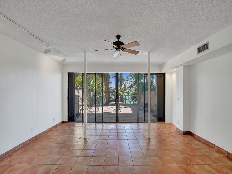 Living area with staircase at 4863 SW 71st Place, Miami