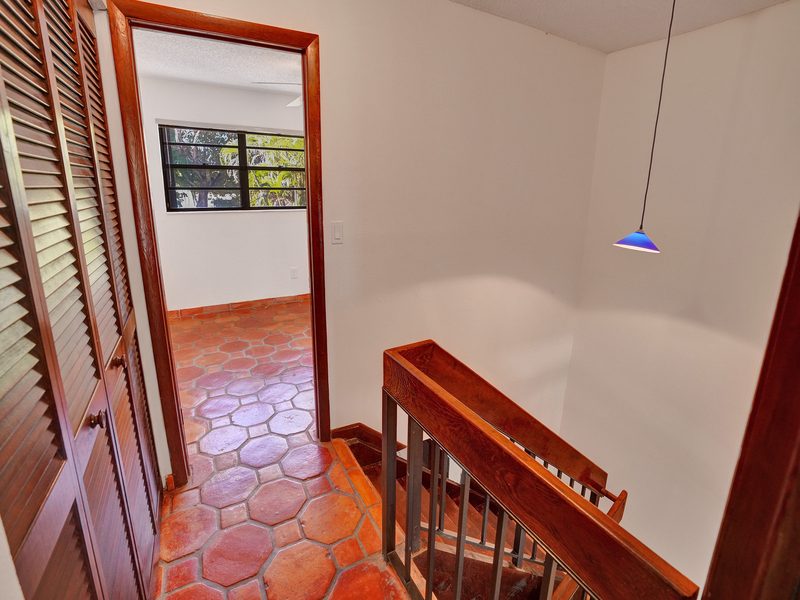 Hallway with terracotta flooring at 4863 SW 71st Place, Miami