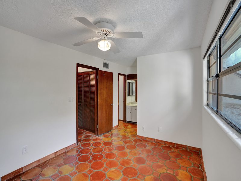 Living area with sliders at 4863 SW 71st Place, Miami