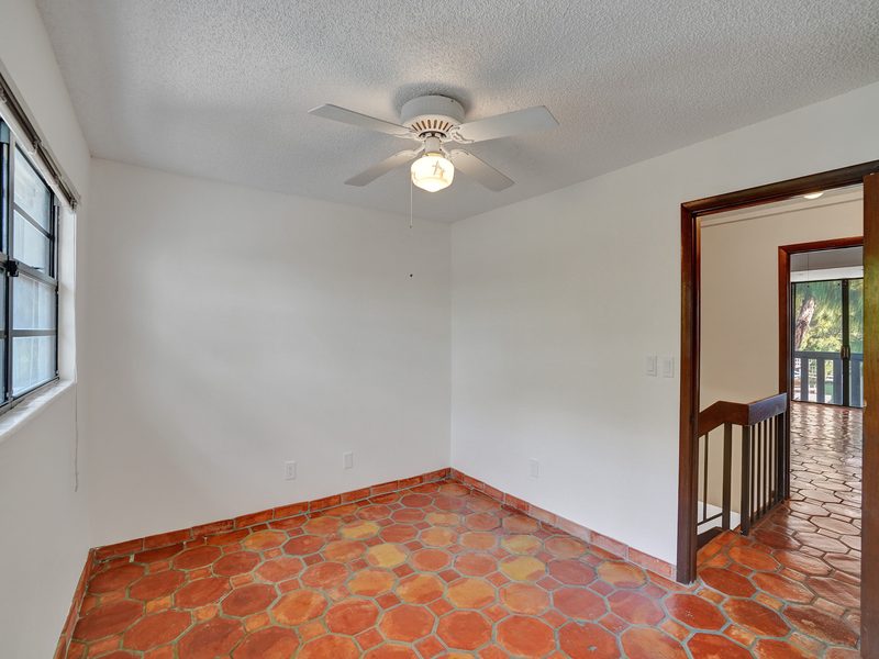 Living area with dark-framed sliders at 4863 SW 71st Place, Miami
