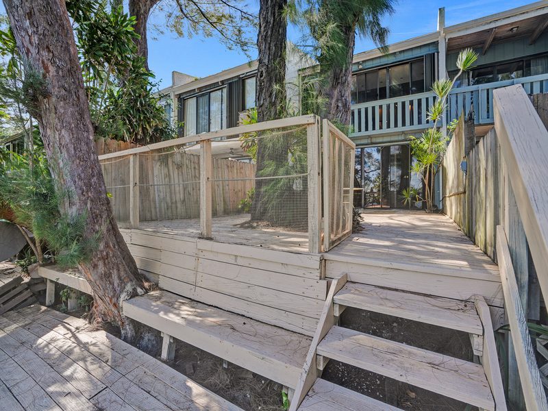 Private deck and stairs to the water at 4863 SW 71st Place, Miami