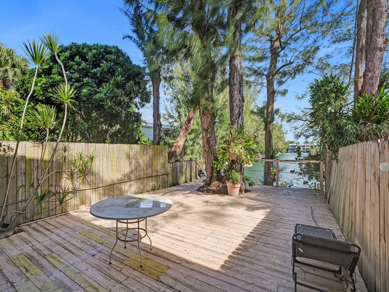 Private deck overlooking the lake at 4863 SW 71st Place, Miami