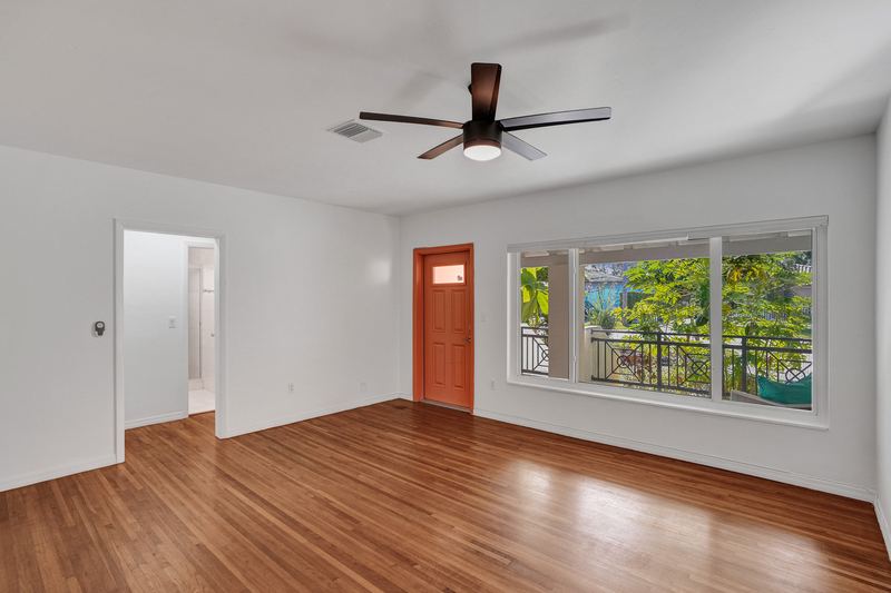 Living room with a window onto the front porch