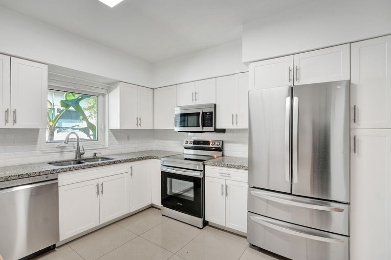Kitchen with a French-door refrigerator and stainless range