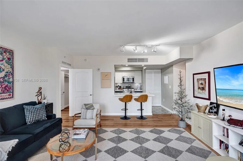 Living and dining at 7350 SW 89th St, Unit 911S, Toscano Condo, Miami