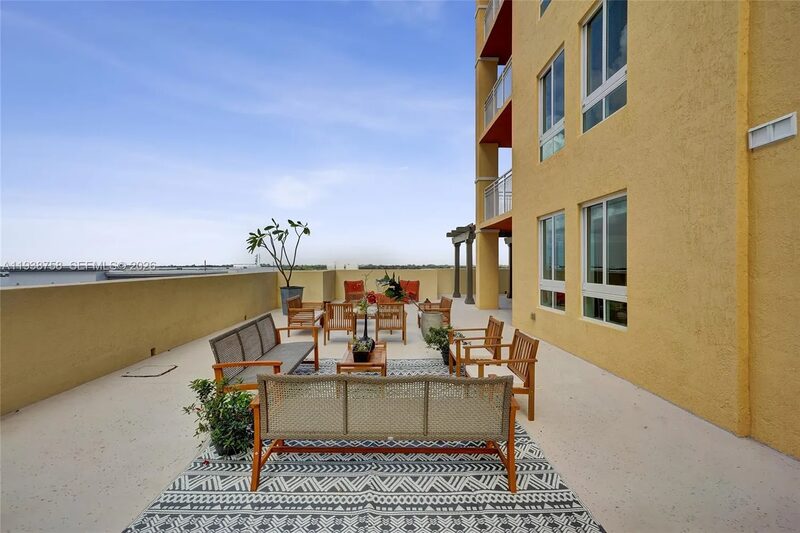 Lounge area on patio at 7350 SW 89th St, Unit 911S, Toscano Condo, Miami