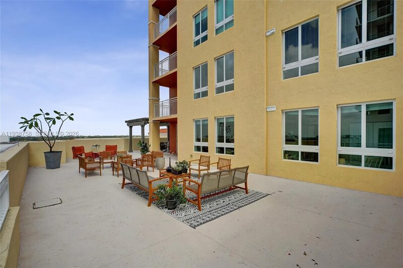 Outdoor dining area at 7350 SW 89th St, Unit 911S, Toscano Condo, Miami