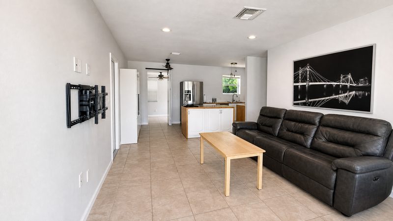 Open living room looking toward the kitchen at 8225 SW 44th Street, Miami