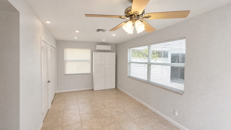 Bright family room with impact windows at 8225 SW 44th Street, Miami