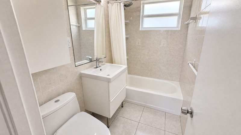 Bathroom with vanity and tub at 8225 SW 44th Street, Miami