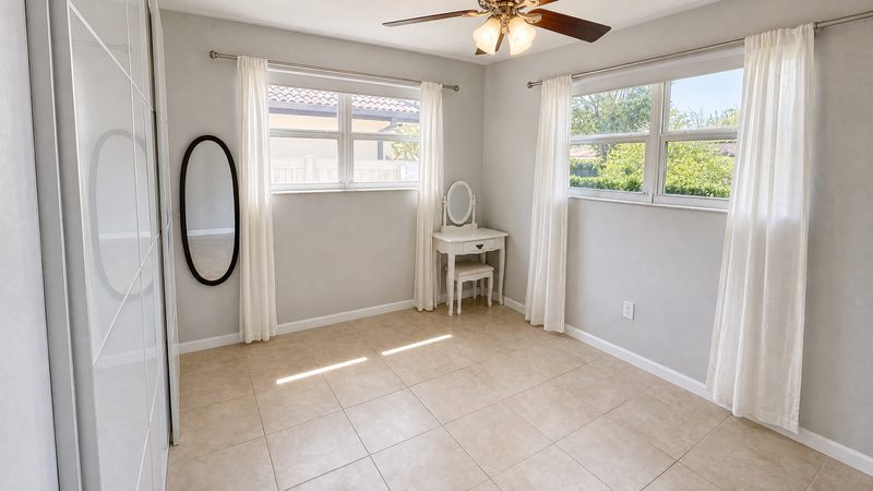 Bedroom with a vanity nook and natural light at 8225 SW 44th Street, Miami