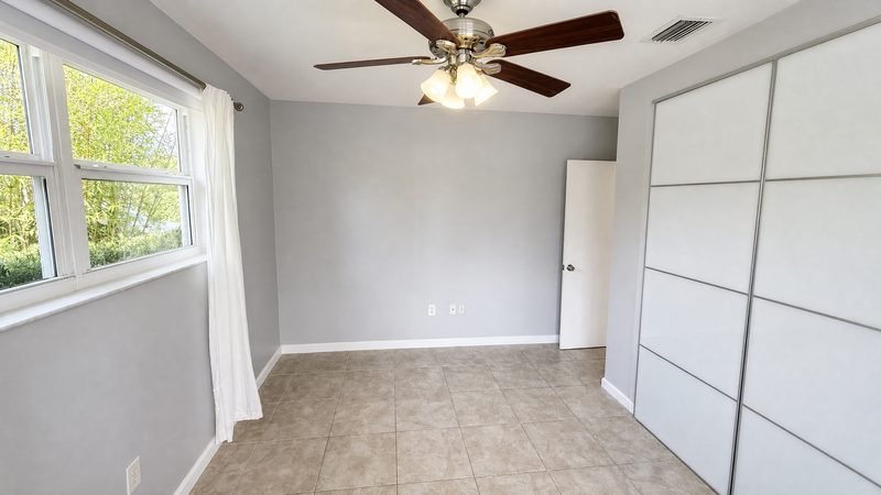 Bedroom with closet and ceiling fan at 8225 SW 44th Street, Miami