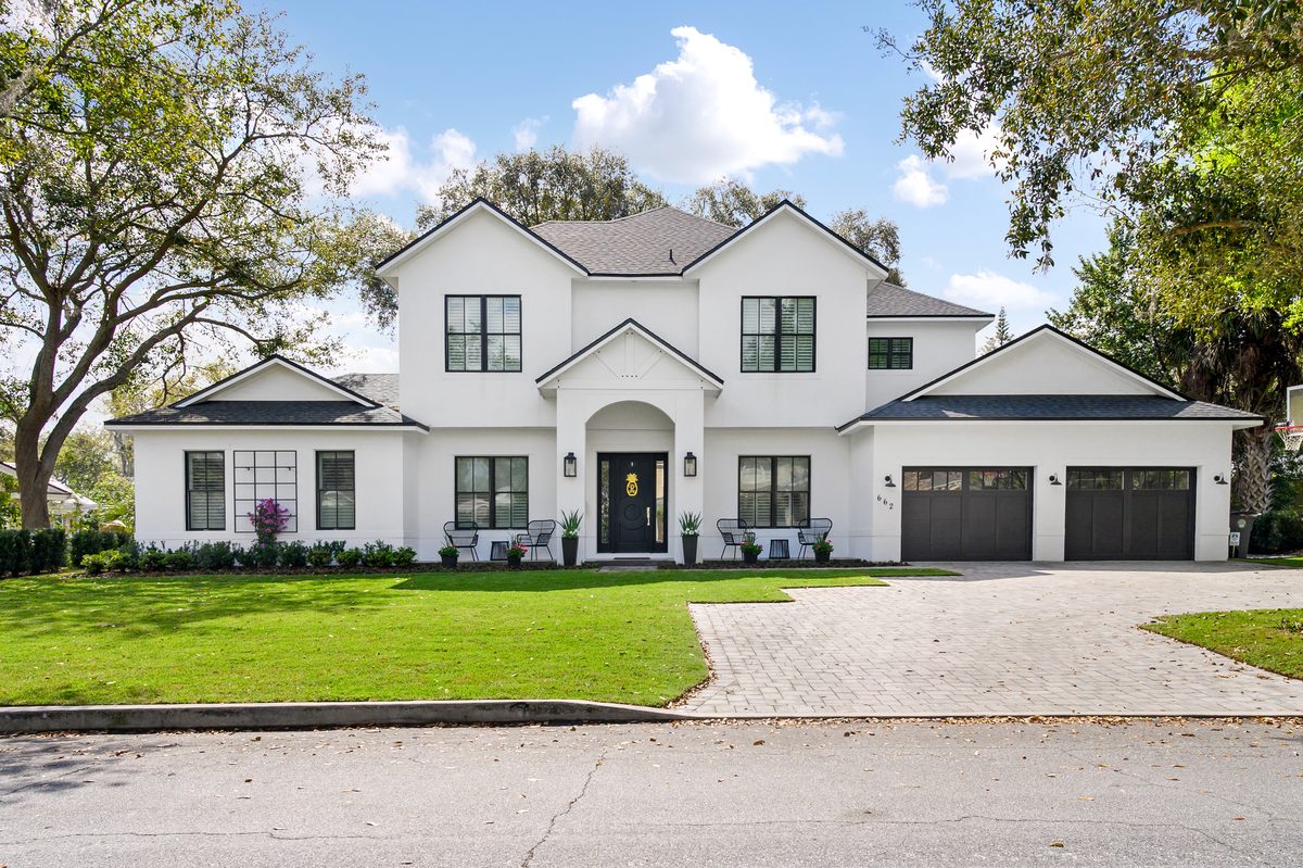 White Florida home exterior representing flood zone and insurance considerations for Miami buyers