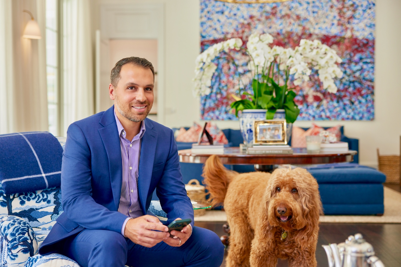 Jorge in a luxury home with dog